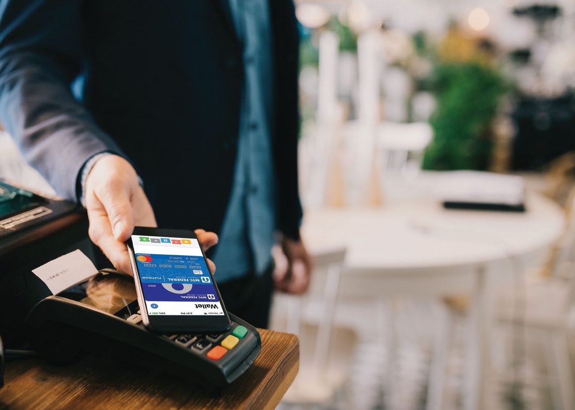 Portrait picture of Person paying for services with their digital wallet